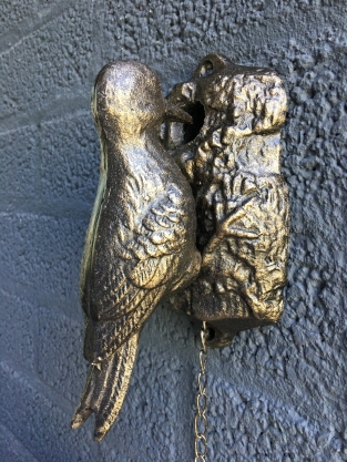 Beautiful distinct door knocker, woodpecker in bronze color, metal.